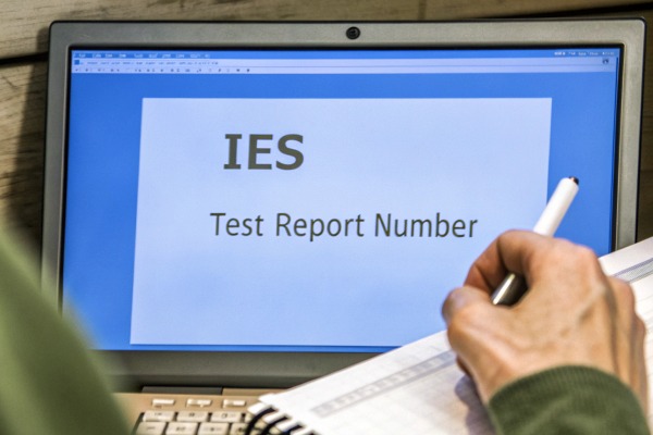 IES test report document with graphs and spectral data